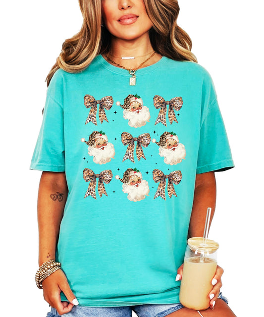 Santa with leopard print hat and bows graphic tee on seafoam green shirt