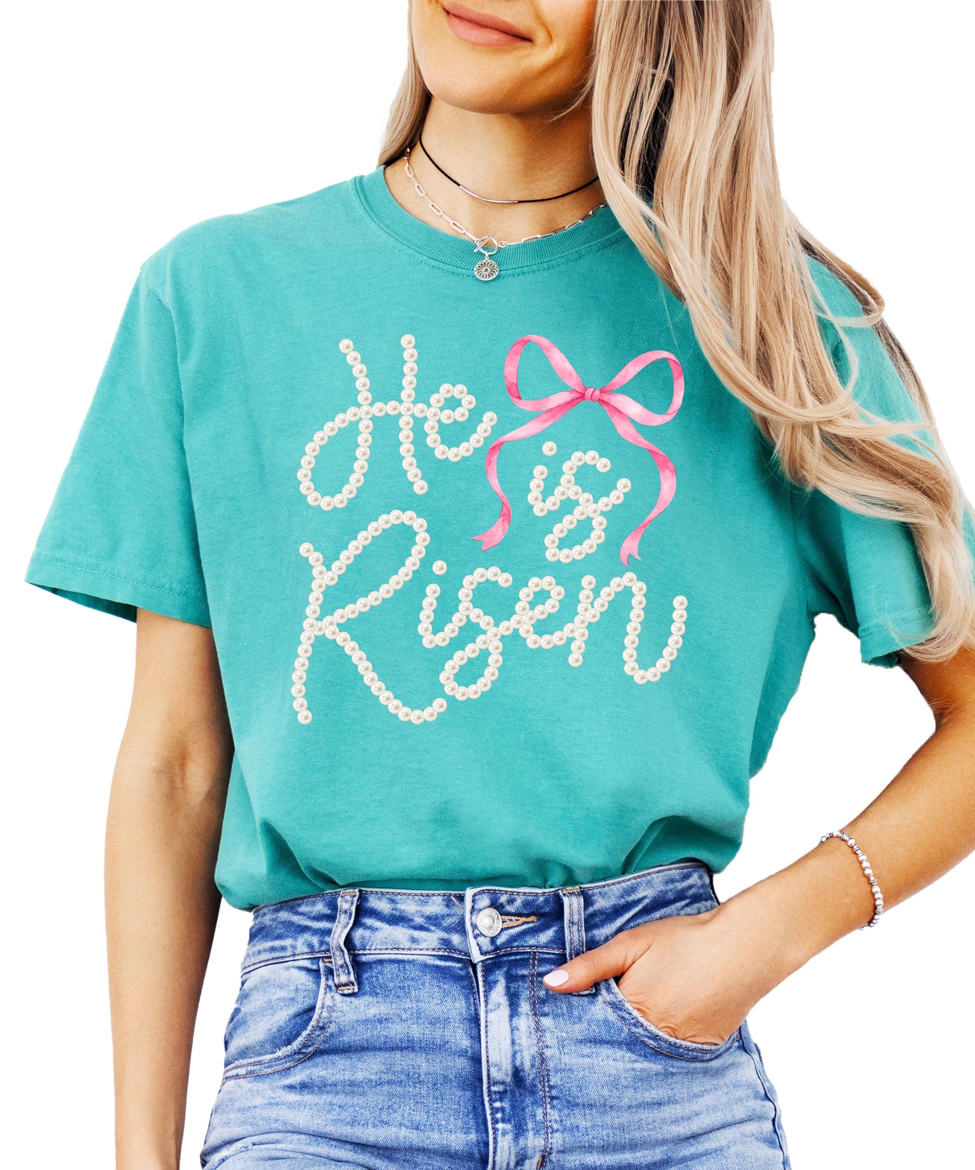 Women modeling He Is Risen faith graphic tee — perfect Easter church outfit with pink bow detail