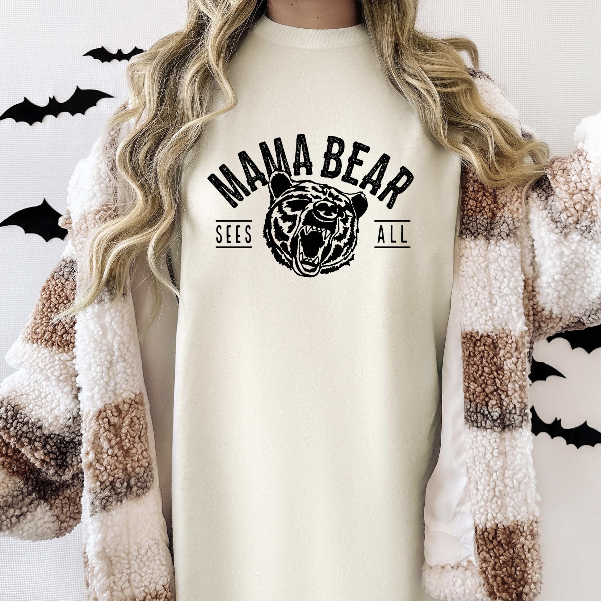 Mama Bear Sees All women's graphic tee laid flat showing full print detail