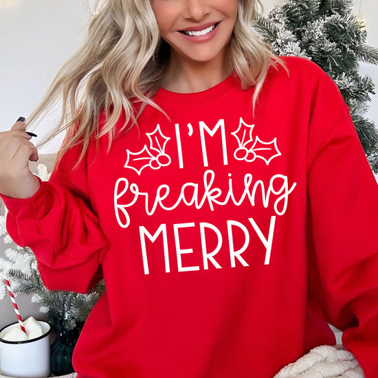 Red holiday crewneck sweatshirt with sarcastic Christmas saying worn by a woman