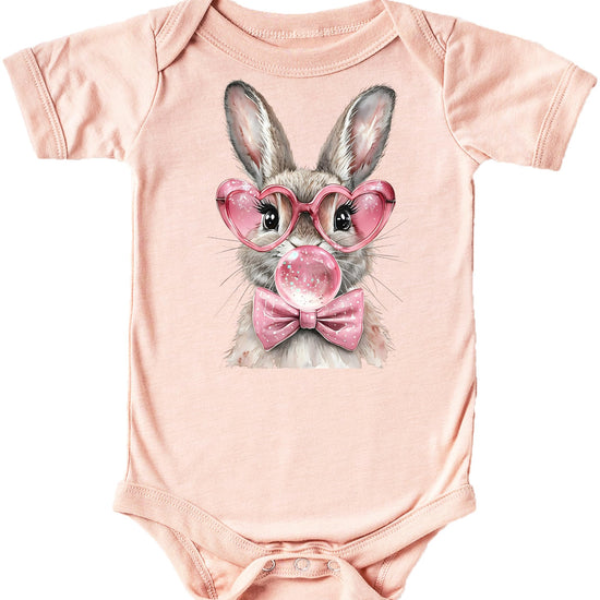 Front view of natural cotton snap-bottom baby onesie featuring cute Easter rabbit with glasses and bow graphic