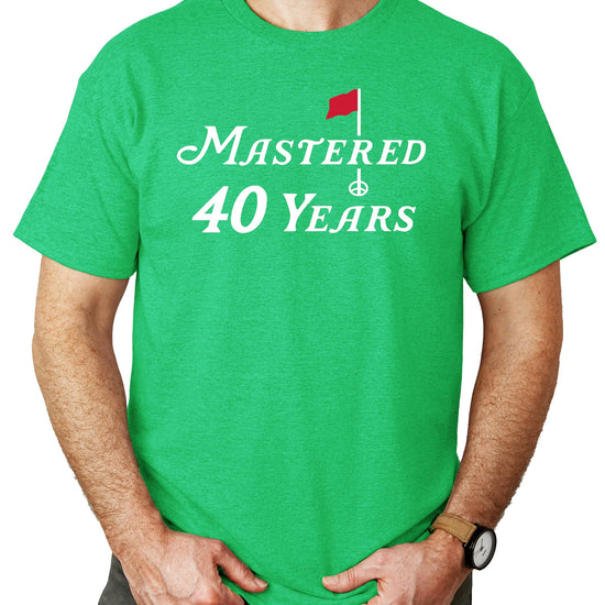 Front view of Mastered 40 Years 40th birthday golf shirt unisex graphic tee in vintage green
