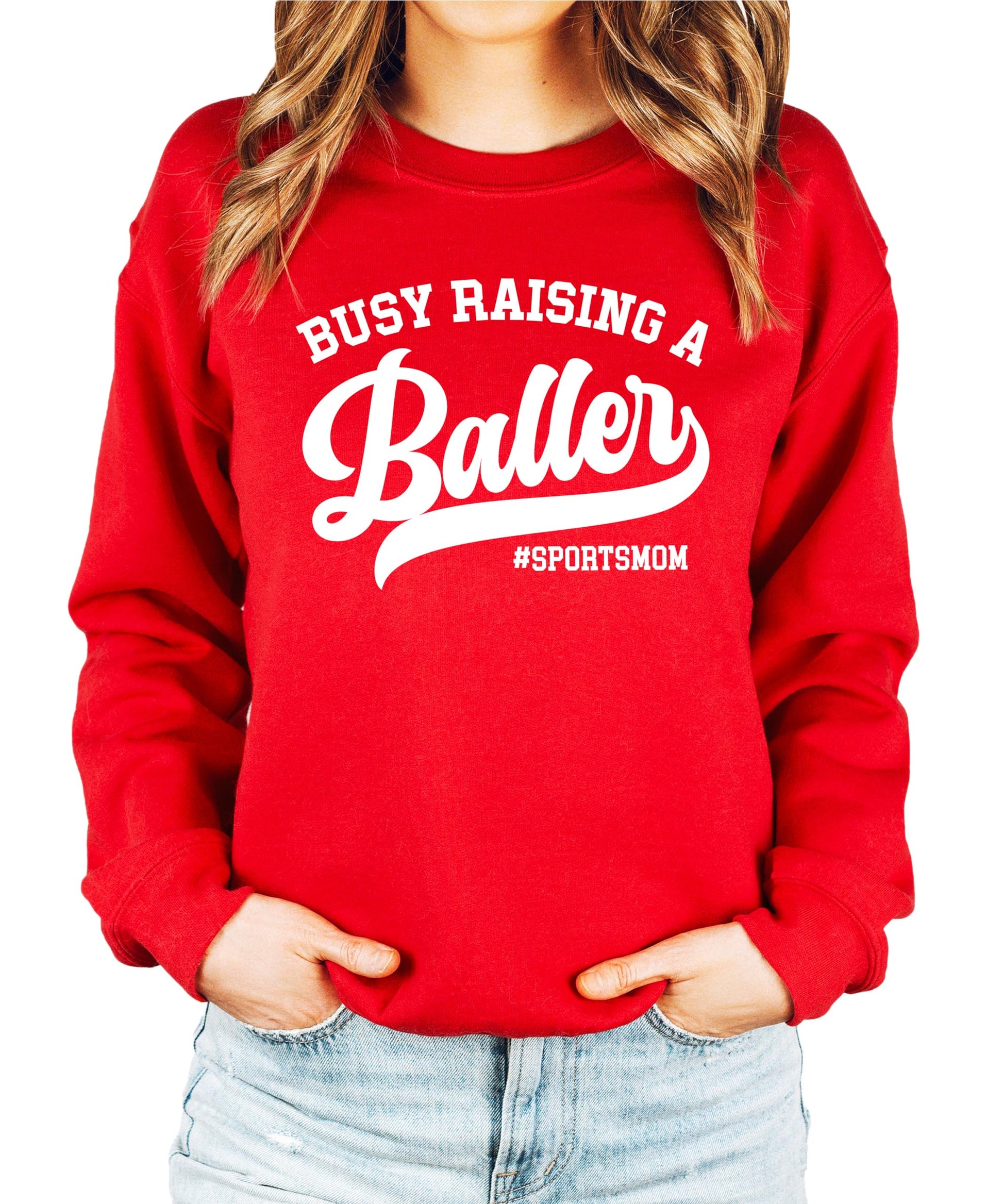 Front view of Busy Raising a Baller black sweatshirt for women, cozy fleece sports mom style