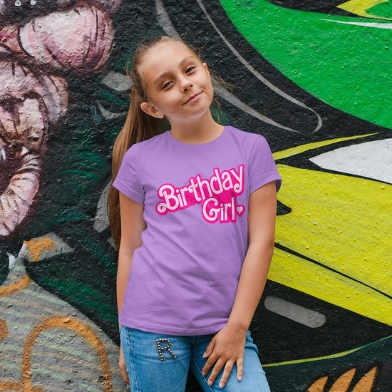 Birthday girl doll themed shirt detail showing vibrant graphic print on purple tee