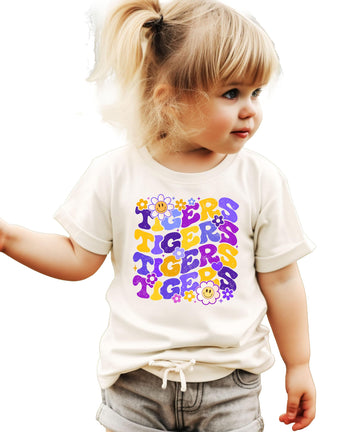 Purple Tigers team spirit graphic tee with retro font and floral design on natural colored shirt
