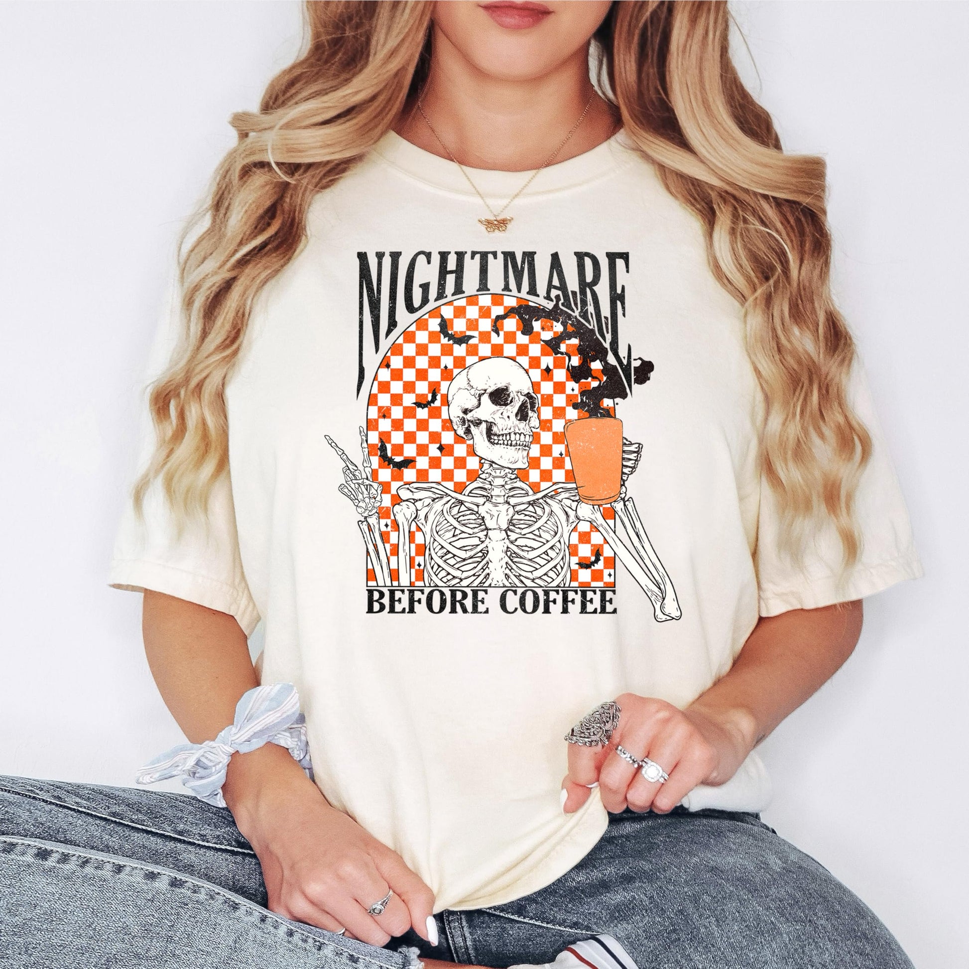 Nightmare Before Coffee women's Halloween shirt laid flat showing full skeleton and bats retro design