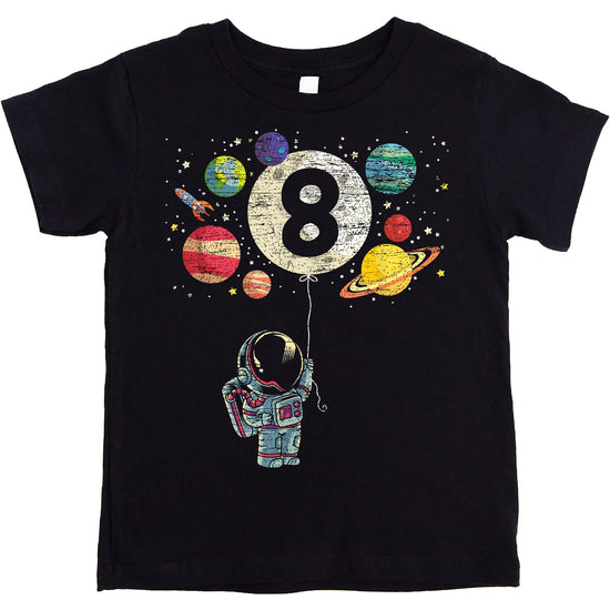Close-up of space-themed birthday tee featuring rocket, moon balloon, and colorful planets