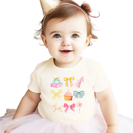 Girly coquette birthday graphic tee for toddlers and girls with watercolor cupcakes, bows, and balloons design in pink