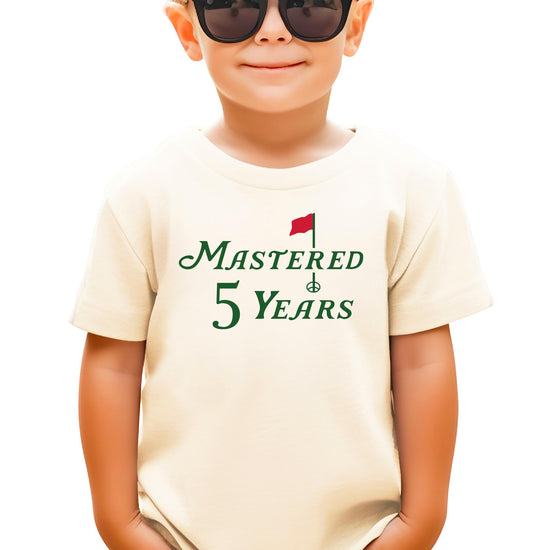 Mastered 5 Years golf-themed fifth birthday t-shirt for kids in natural color, front view