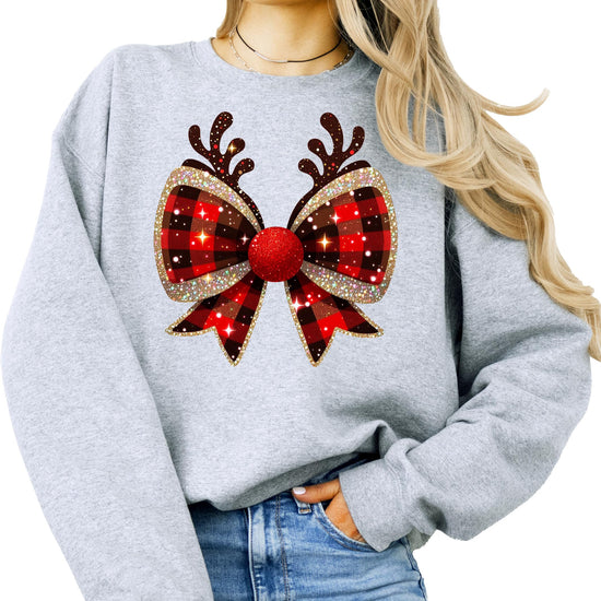 Christmas bow reindeer antlers graphic tee lifestyle photo worn by woman in festive setting