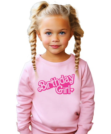 Toddler girl wearing pink Birthday Girl sweatshirt at birthday party