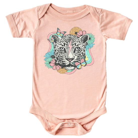 Close-up of retro leopard floral graphic print on peach girls tee by Olive Loves Apple