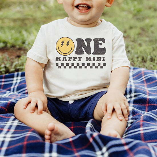 Full family wearing matching One Happy Mom Mini groovy first birthday graphic tees