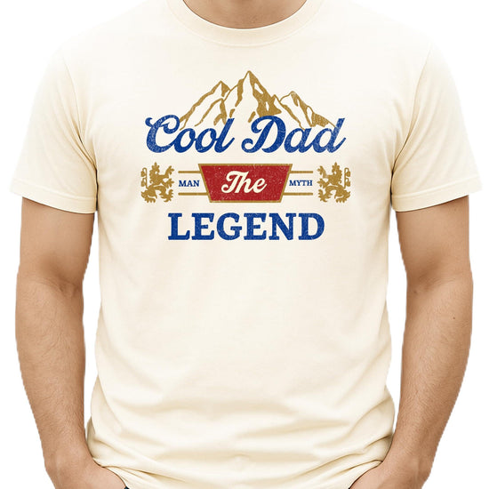 Black men's graphic tee with bold 'Man Myth Legend Cool Dad' vintage mountain design