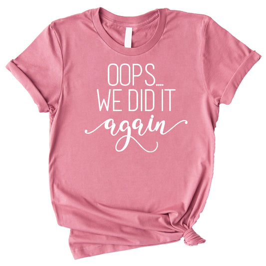 Close-up of Oops We Did It Again pregnancy shirt graphic print detail