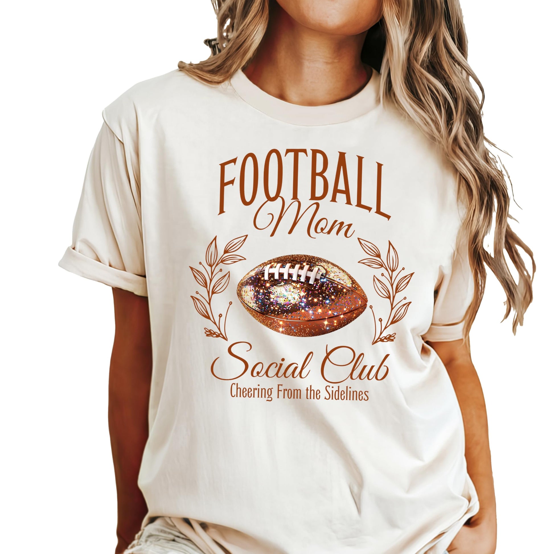 Close-up of faux glitter football graphic on seafoam women's oversized tee