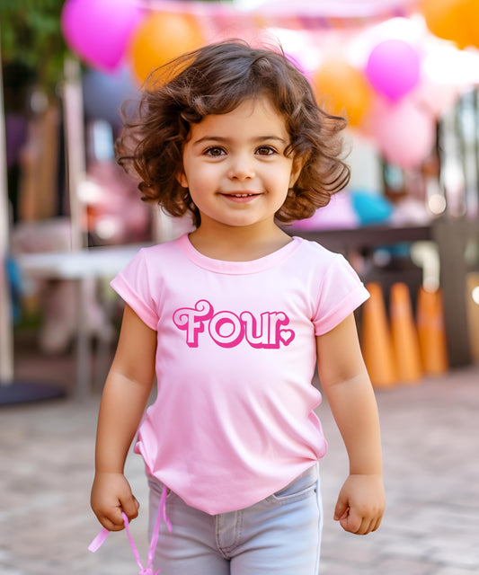 Little girl wearing pink fourth birthday graphic tee at party