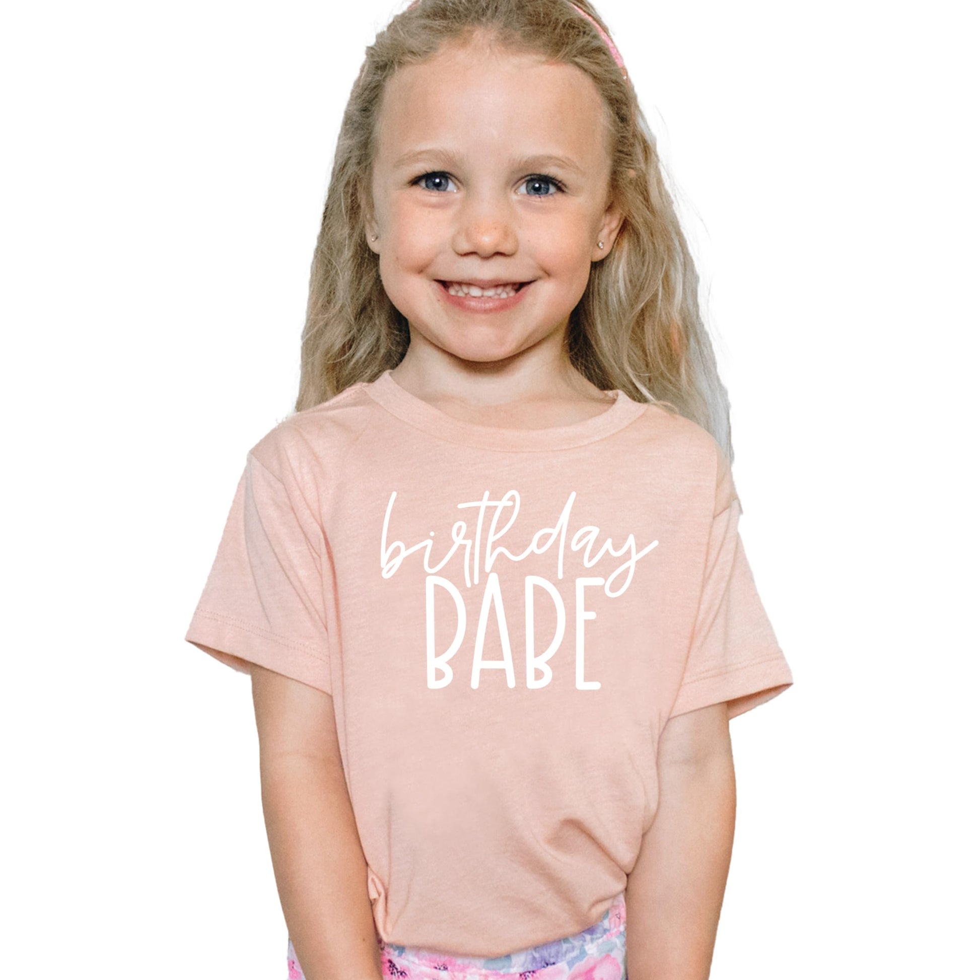 Toddler girl wearing purple Birthday Babe graphic birthday shirt