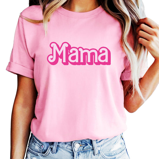 Woman and young girl wearing matching pink Mama and Mini tees outdoors