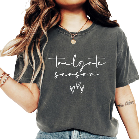 Woman modeling ivory Tailgate Season shirt in casual game day outfit