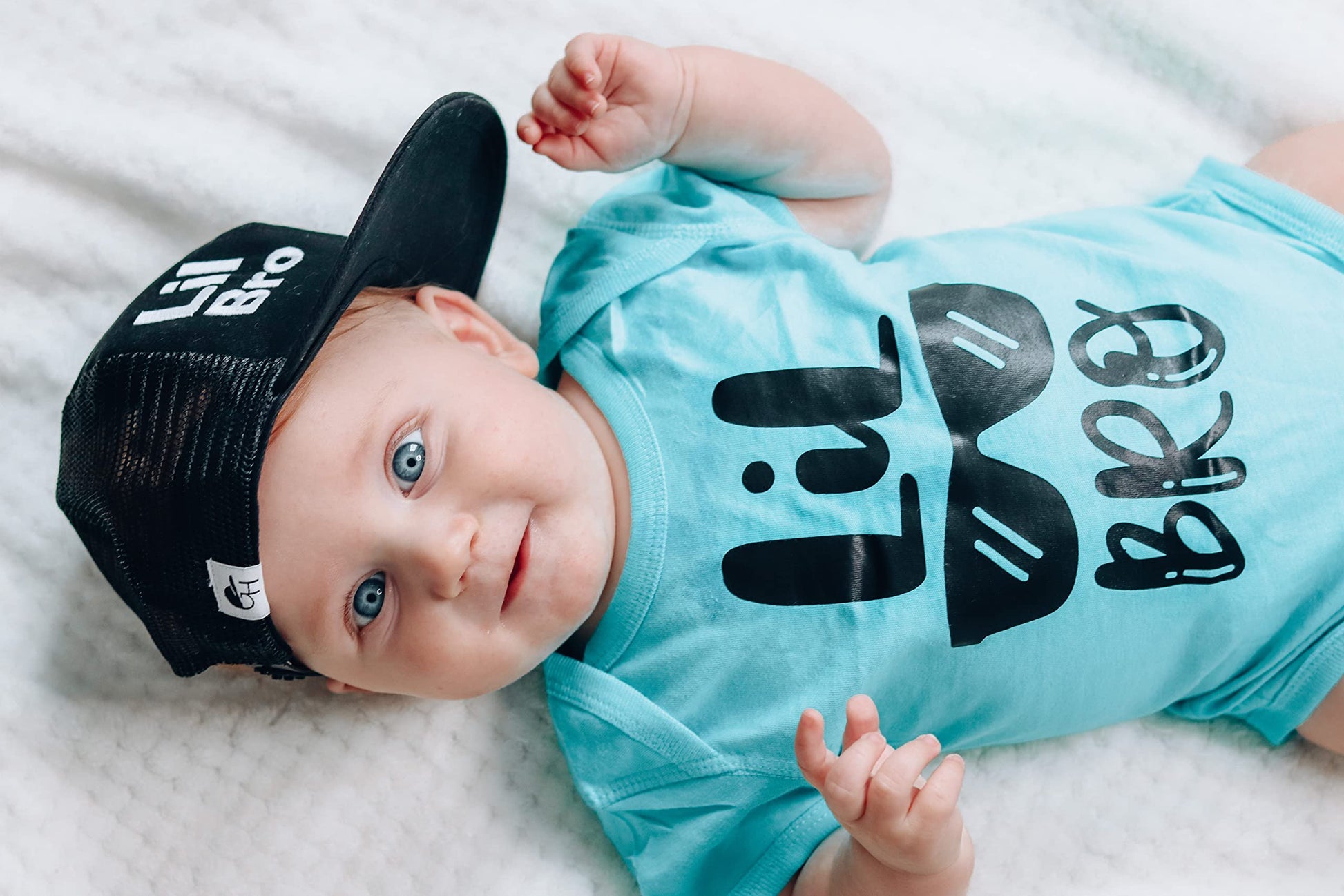 Little Bro Glasses bodysuit displayed as a baby shower gift idea