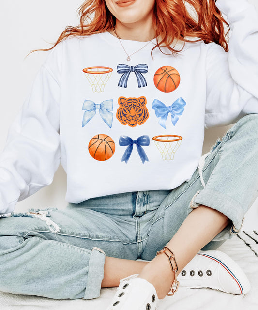 Close-up of Tigers mascot coquette bows basketball graphic on white sweatshirt