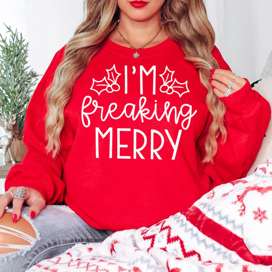 Front view of funny red women's crewneck sweatshirt with bold holiday graphic design