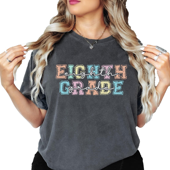 Eighth Grade teacher t-shirt with bold pastel lettering on a soft unisex tee