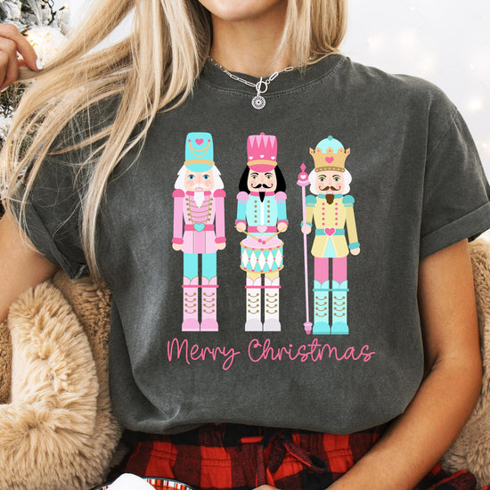 Lifestyle flat lay of women's pastel nutcracker Christmas t-shirt