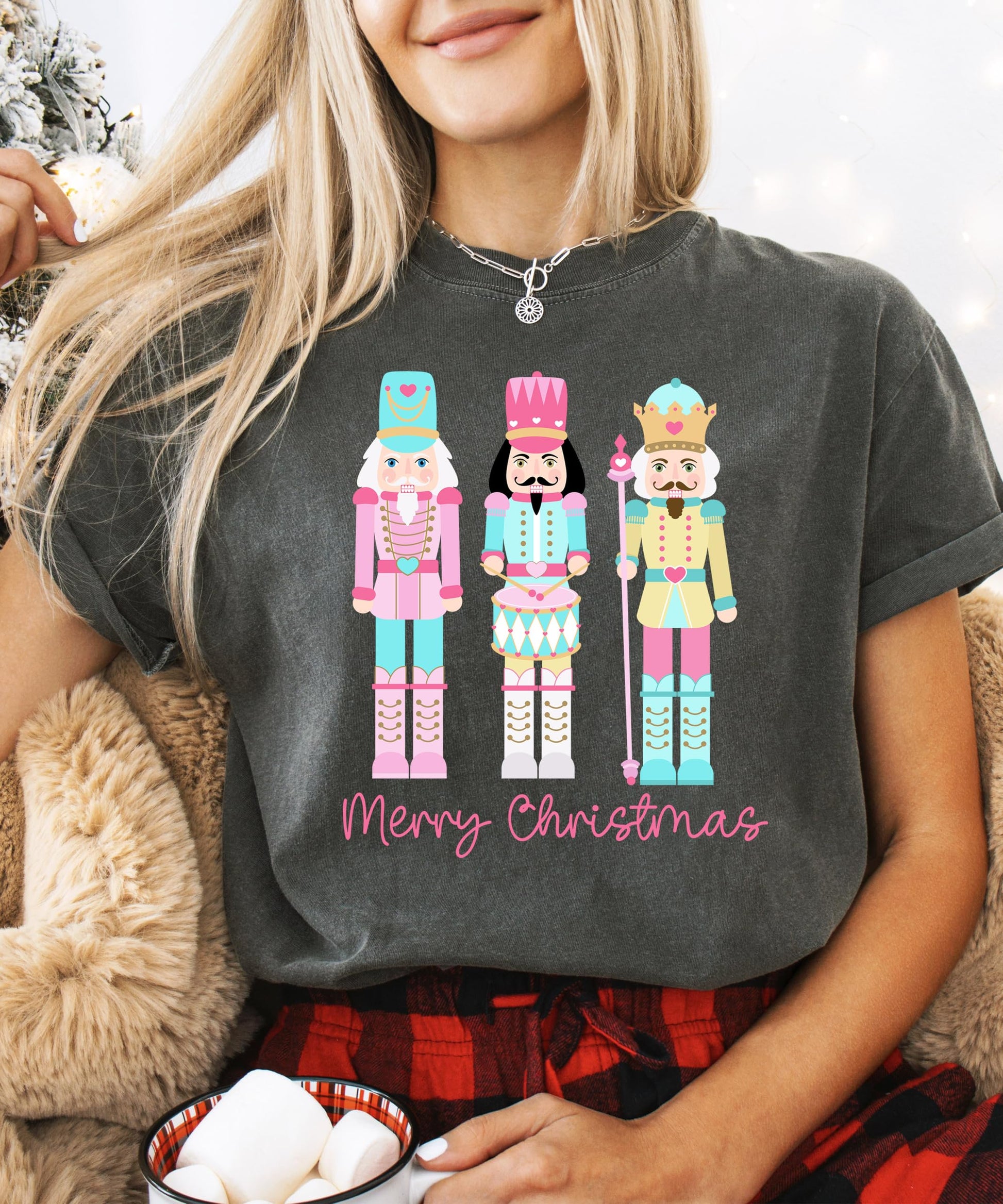 Lifestyle flat lay of women's pastel nutcracker Christmas t-shirt