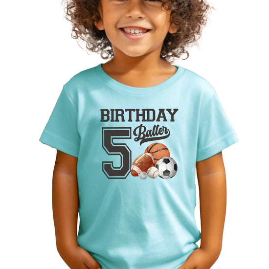 Close-up of Birthday Baller fifth birthday graphic print on black youth tee