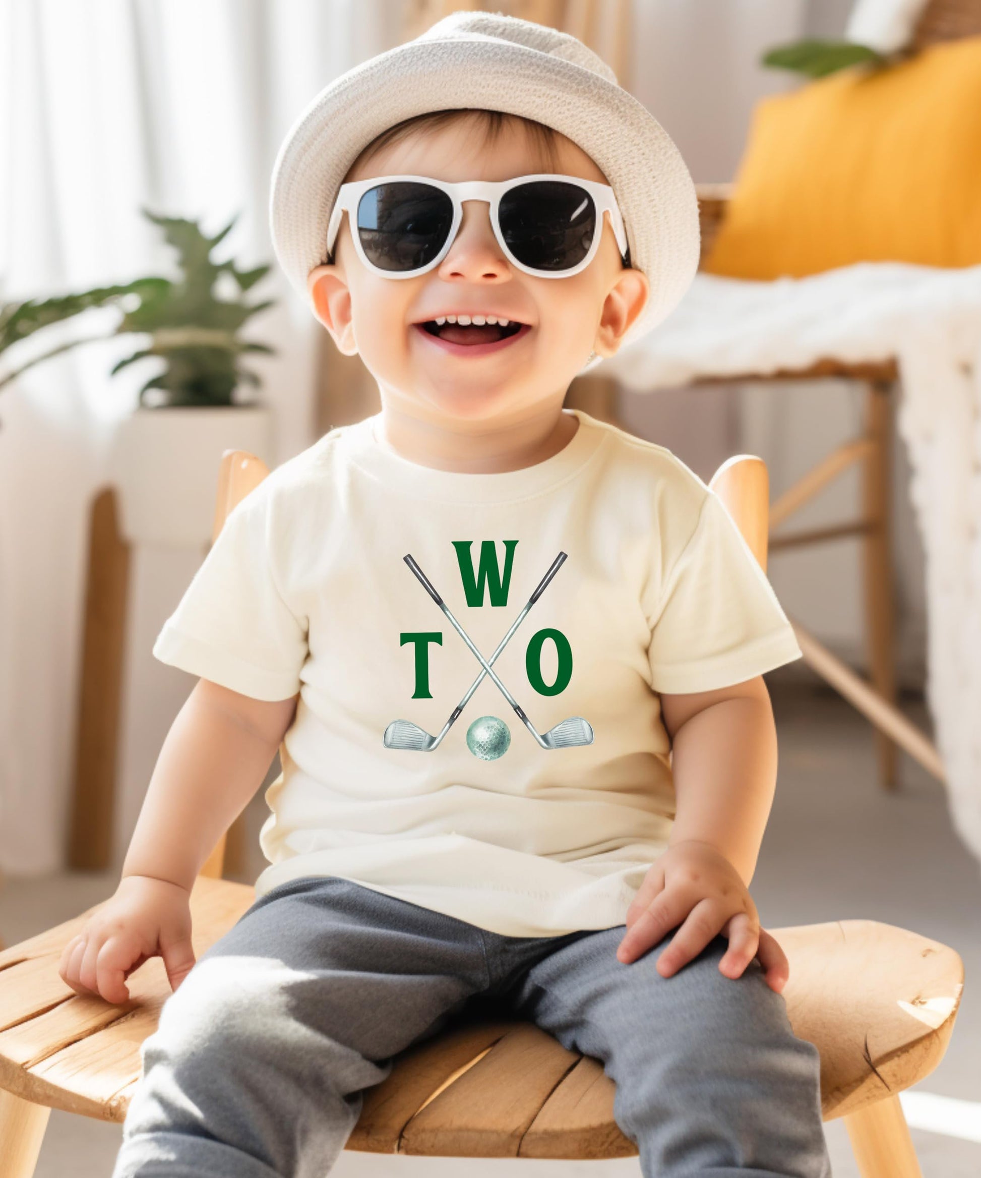 Close-up of Two Golf Sticks golf birthday shirt design on toddler tee