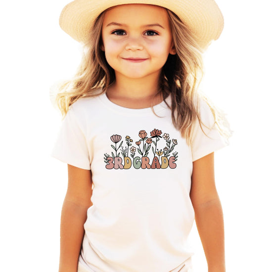 Girls military green 3rd grade floral graphic tee with flower design and bold lettering, front view