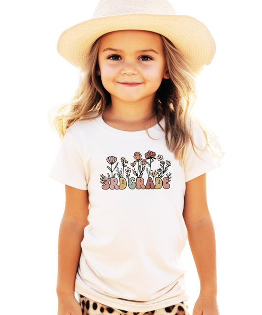 Girls military green 3rd grade floral graphic tee with flower design and bold lettering, front view