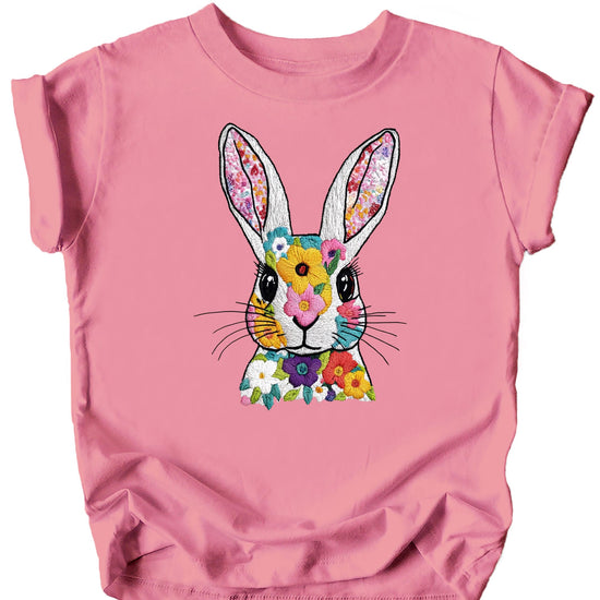 Close-up of faux embroidery bunny and floral print detail on pastel Easter shirt