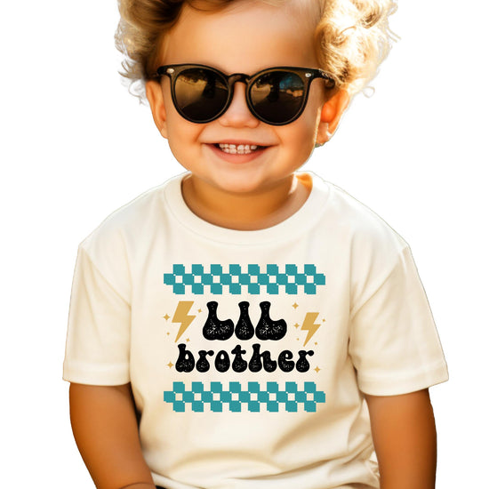 Little brother retro lightning bolt graphic tee for toddler boys, sibling reveal shirt in natural