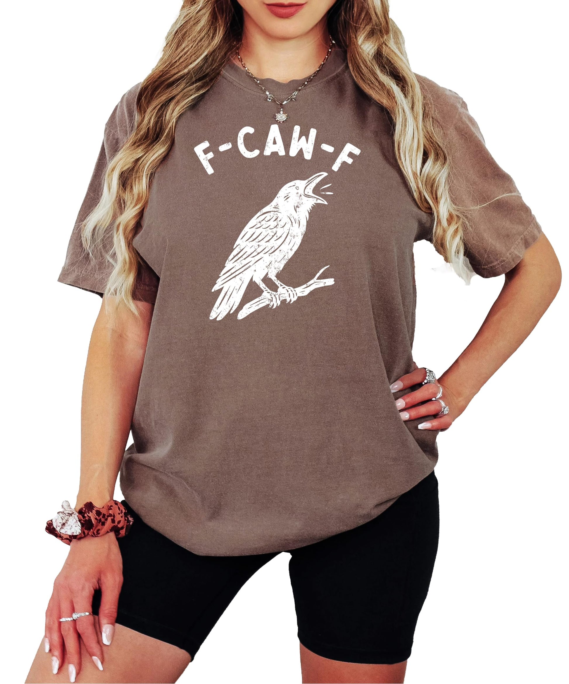 Close-up of F-Caw-F crow graphic print on seafoam Halloween tee showing print detail and quality