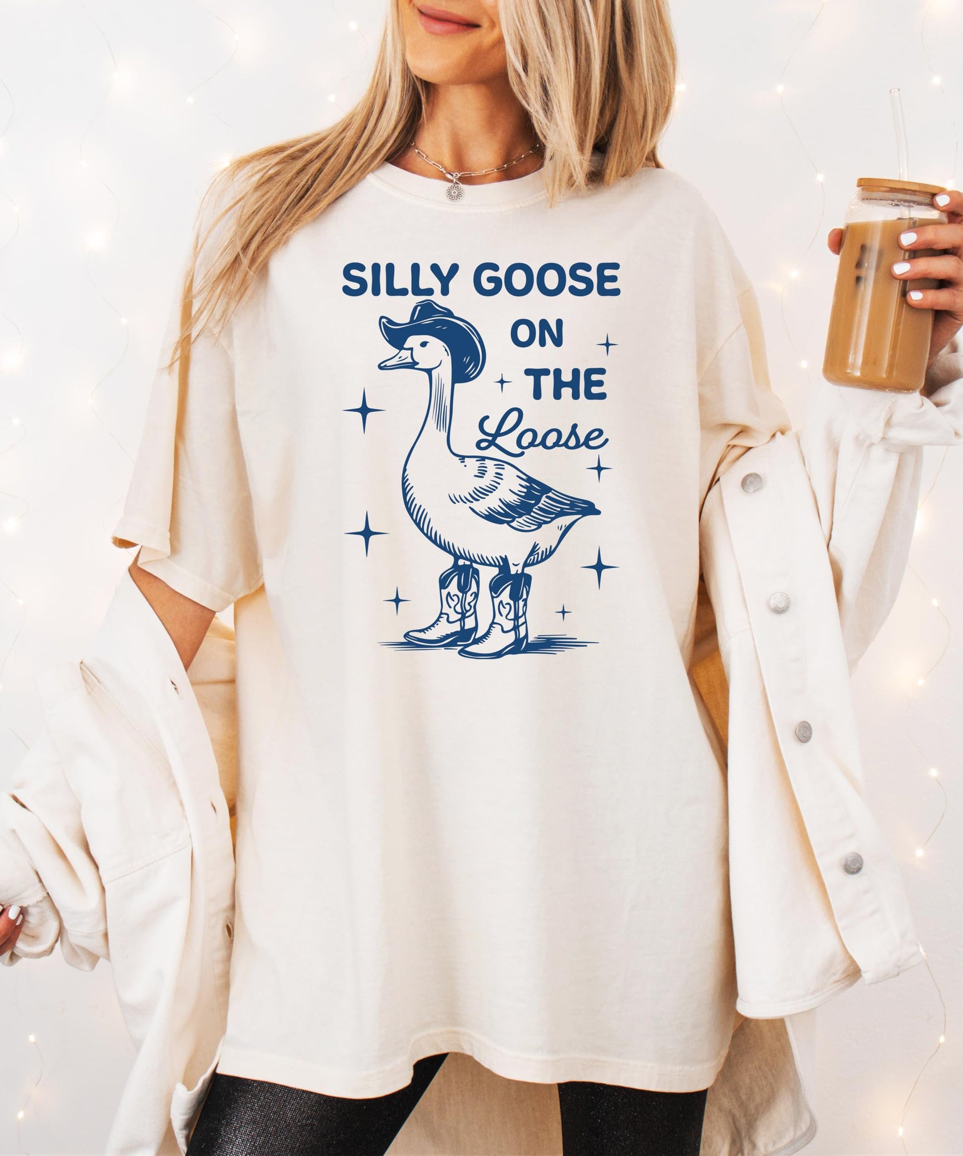 Flat lay of Silly Goose on the Loose ivory graphic tee for women