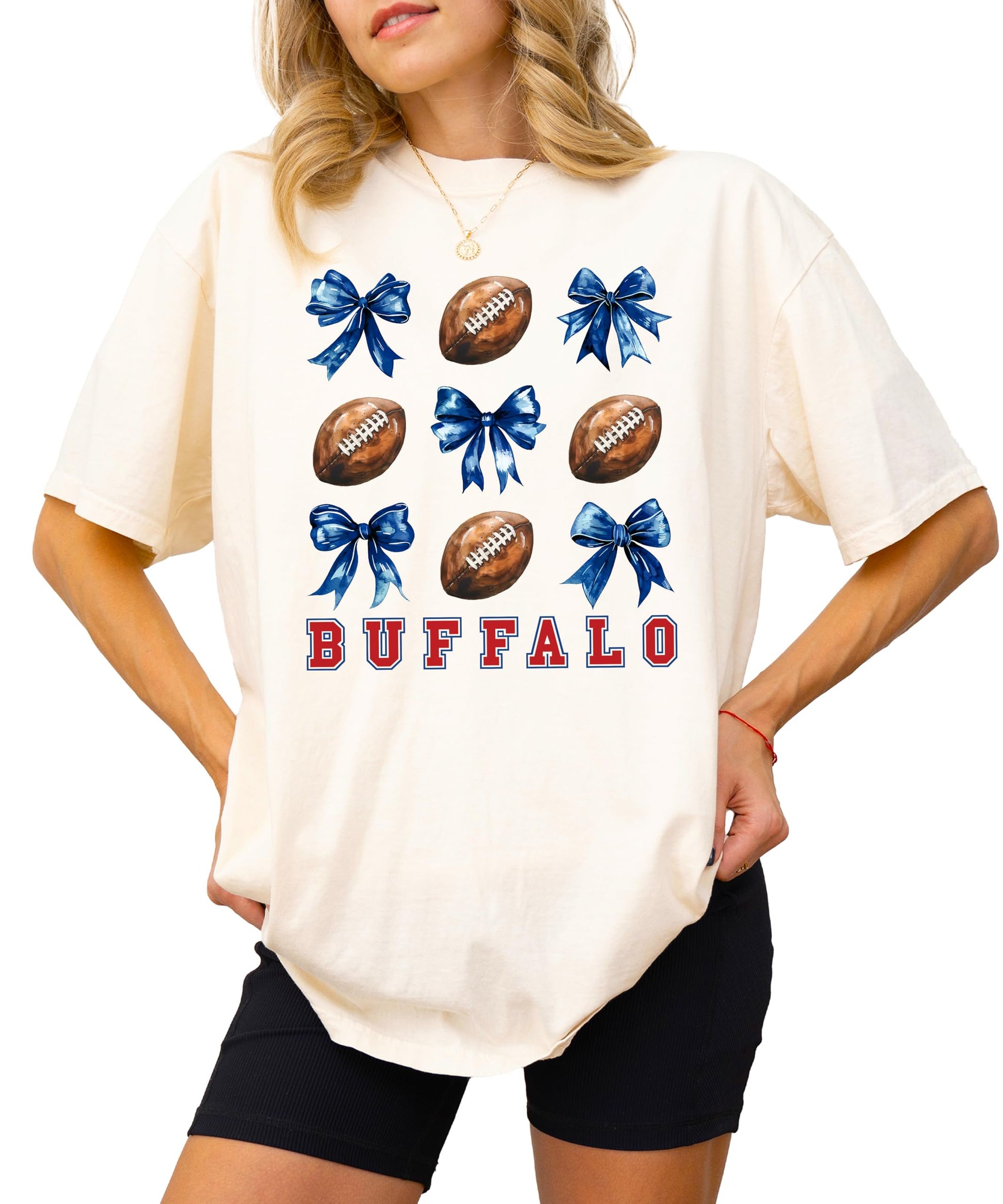 Front view of ivory girly Buffalo football graphic tee with bows and football design for women
