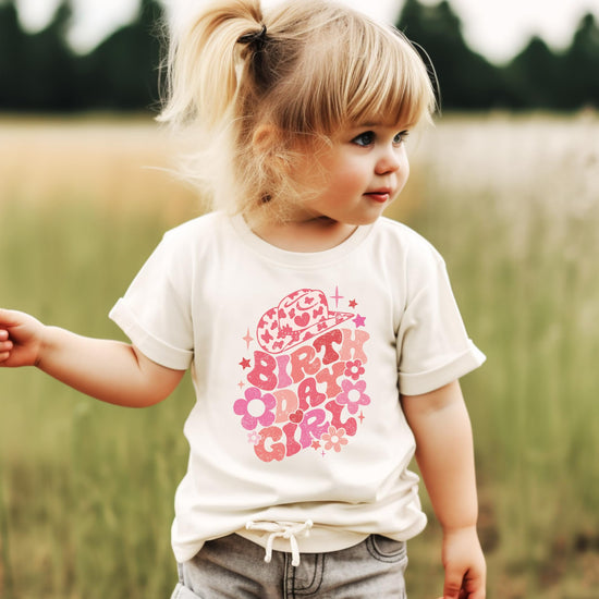 Front view of toddler birthday girl groovy cowgirl natural shirt