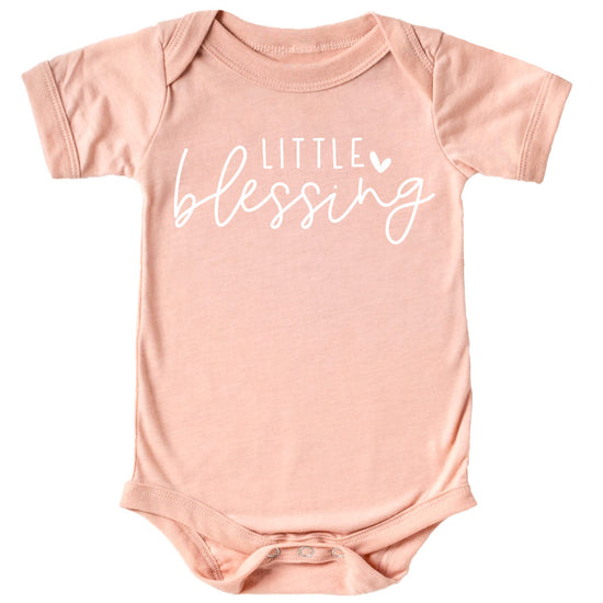 Little Blessing Heart baby girl bodysuit on model, perfect for newborn photos or take-home outfit