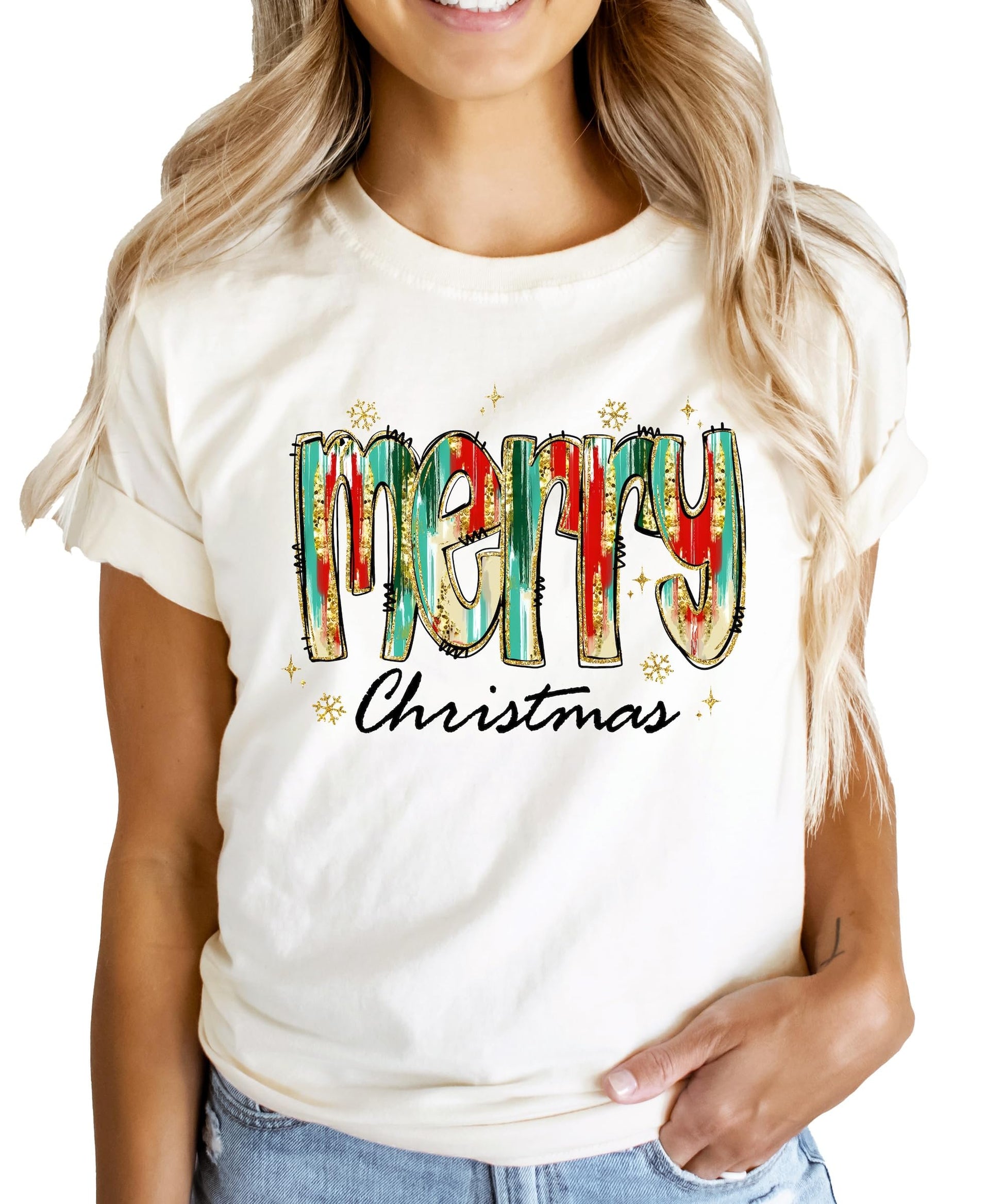 Close-up of vibrant watercolor Merry Christmas graphic print on peach holiday shirt