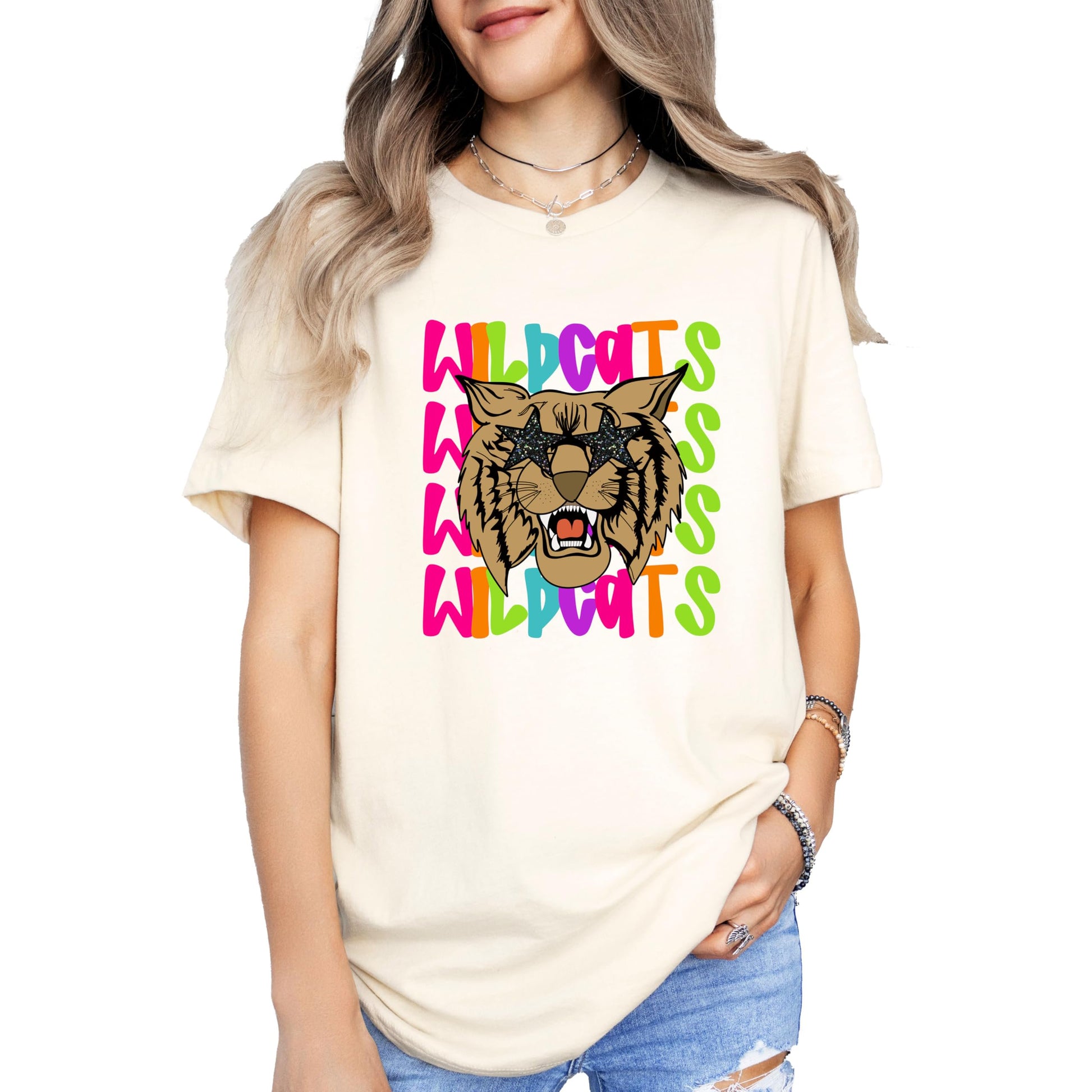 Black women's t-shirt with wildcats school spirit graphic laid flat