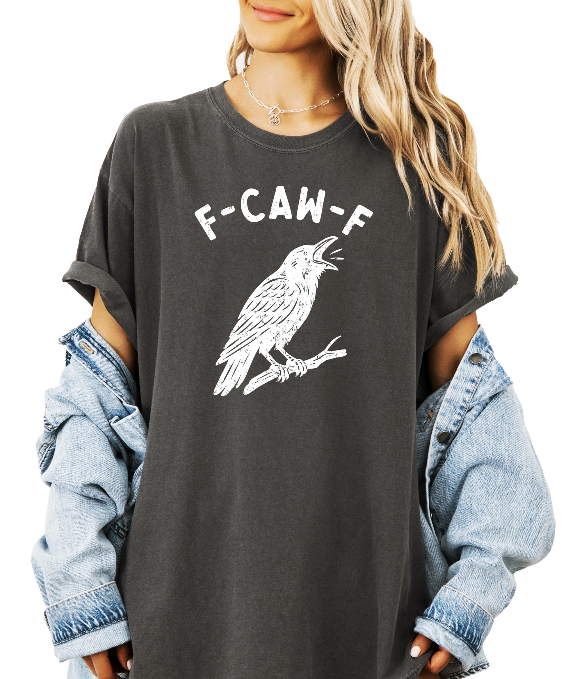 Flat lay of seafoam adult Halloween graphic tee with humorous black crow F-Caw-F design