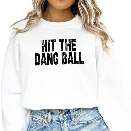 Side or angled view of red Hit The Dang Ball women's graphic pullover sweatshirt