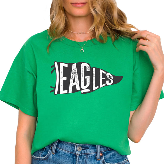 Woman wearing Eagles school pride shirt in casual setting