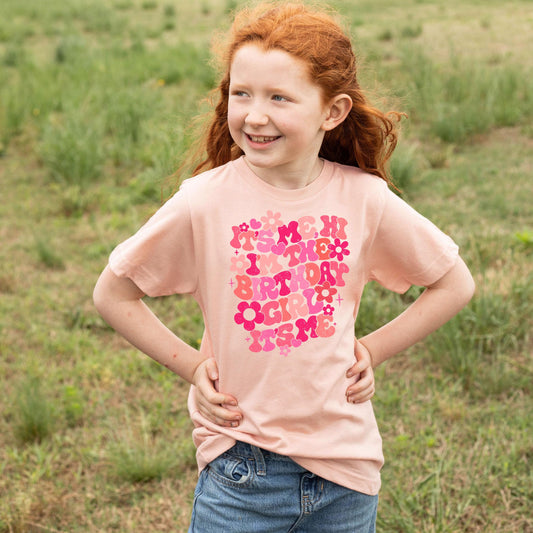 Side or back view of peach groovy birthday graphic tee for girls