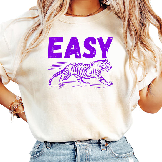 Women's ivory graphic tee with purple Easy Tiger text and running tiger design, front view