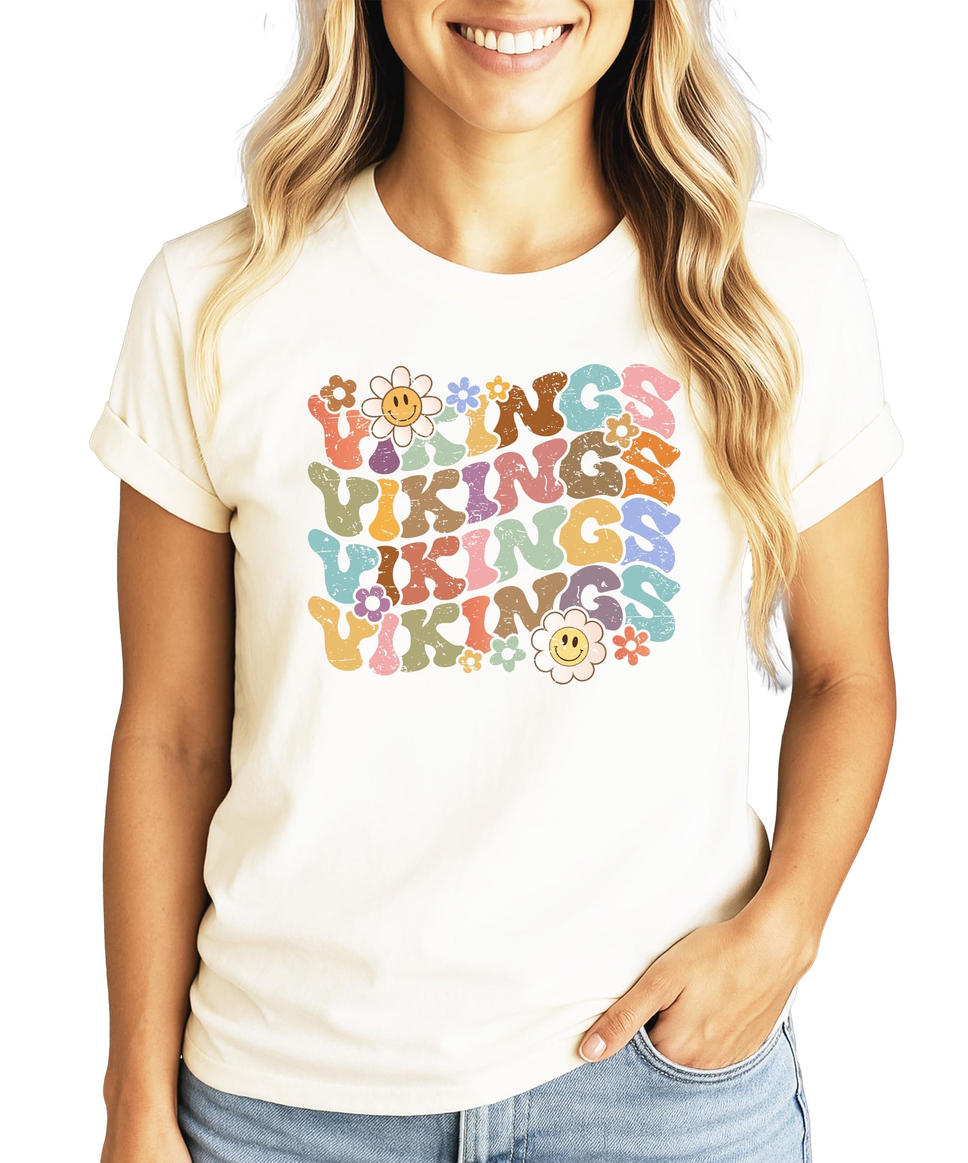 Close-up of Vikings team pride shirt showing colorful retro lettering with flowers and happy faces