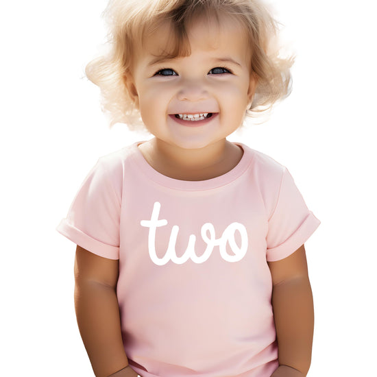 Side view of purple toddler birthday shirt with cursive Two design for girls second birthday